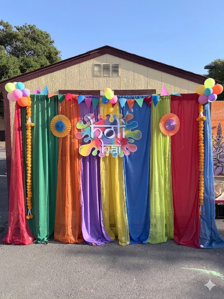 Full Holi backdrop with fabric drapes and festive decor